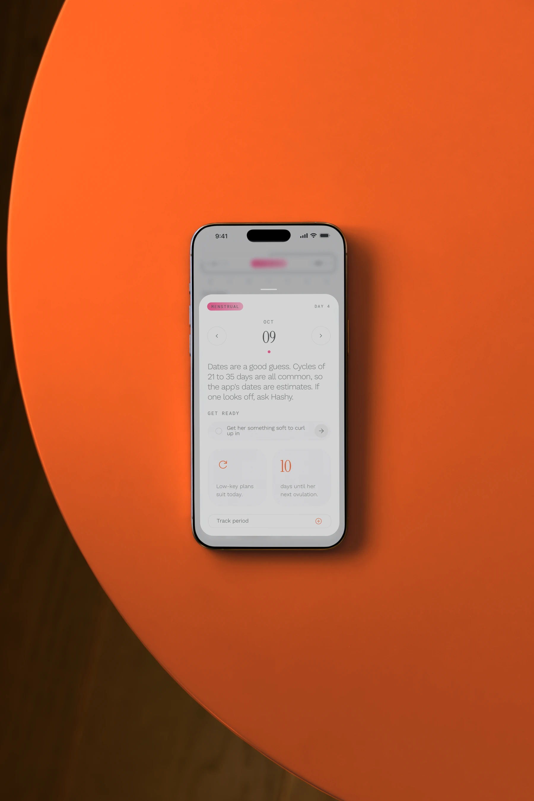 A phone lying on an orange table, showing the field. calendar and today's day sheet